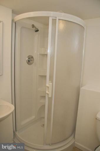 1201 North Point Road Dundalk, MD 21222 - Photo 16 of 17 a bathroom with a glass shower door