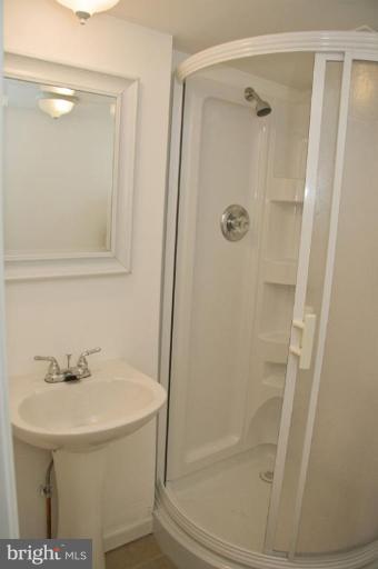 1201 North Point Road Dundalk, MD 21222 - Photo 3 of 17 a bathroom with a bathtub and a shower