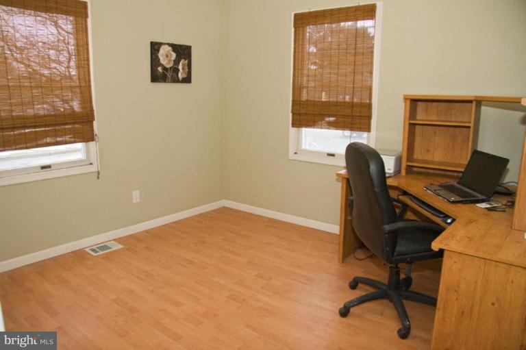 1201 North Point Road Dundalk, MD 21222 - Photo 5 of 17 a view of a workspace with furniture and a window