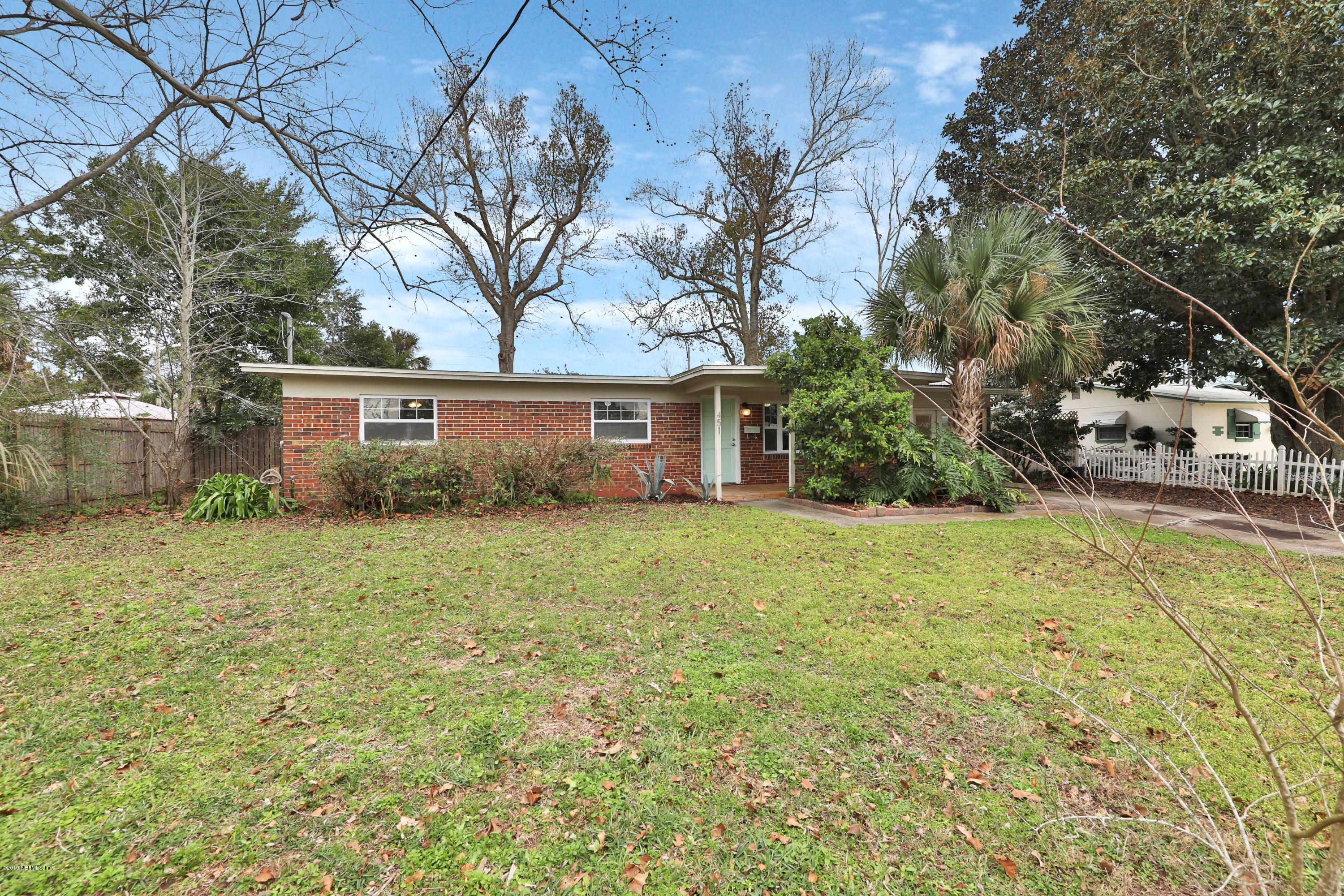 451 Sargo Road Atlantic Beach, FL 32233 - Photo 2 of 18 a view of a house with a yard and garage