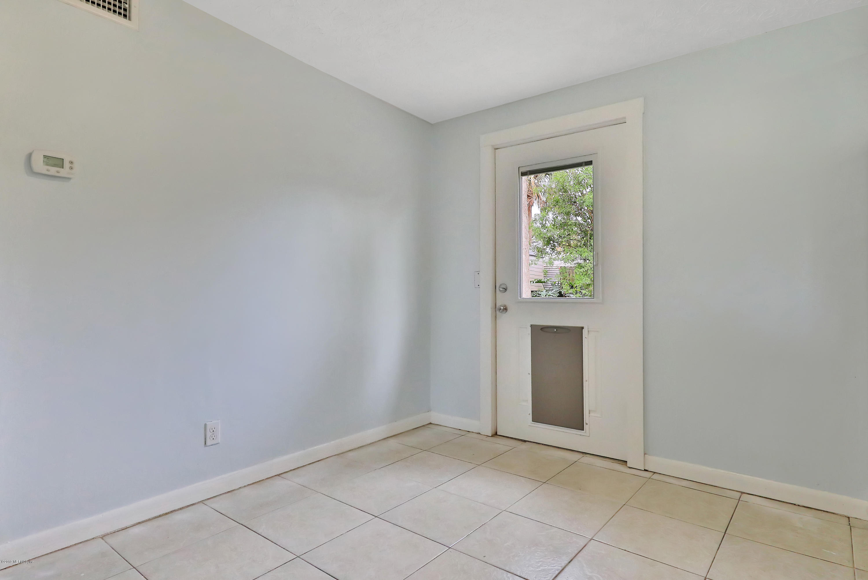 451 Sargo Road Atlantic Beach, FL 32233 - Photo 7 of 18 an empty room with windows