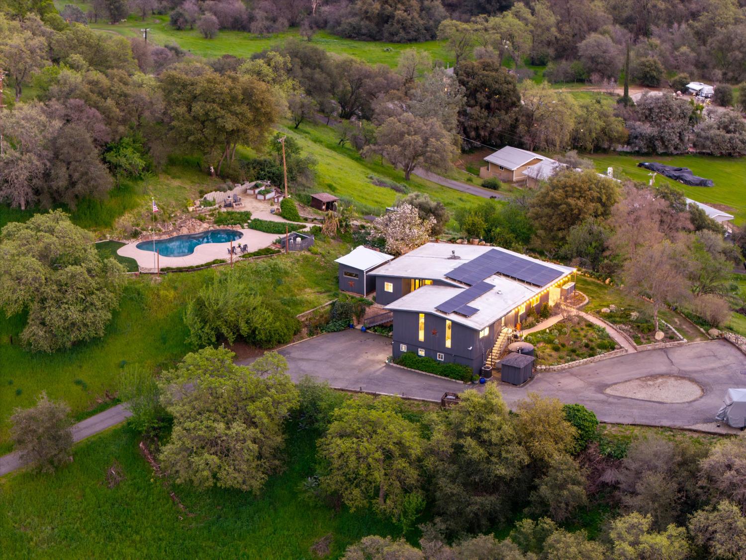 8470 Horseshoe Hill Road Loomis, CA 95650 - Photo 1 of 1 an aerial view of a house with a garden