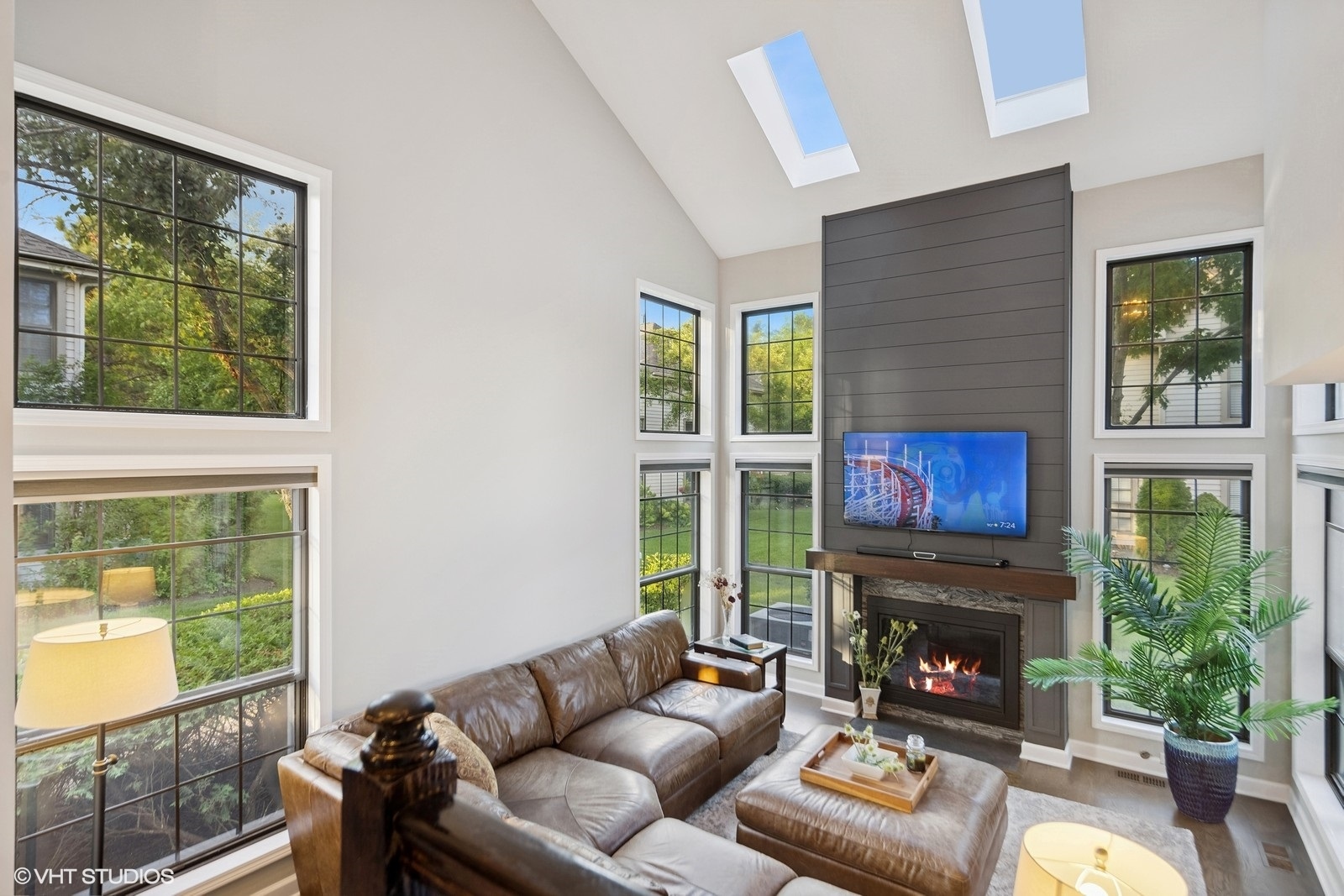 199 Springdale Lane Bloomingdale, IL 60108 - Photo 13 of 70 a living room with furniture a fireplace and a large window