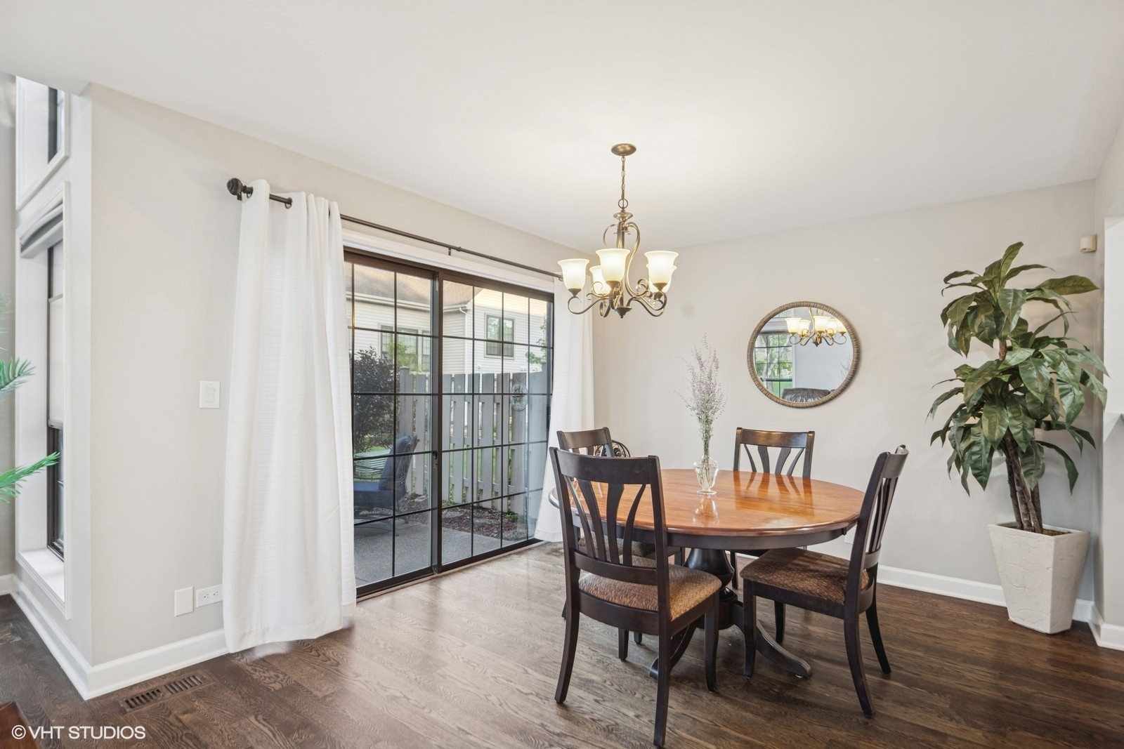 199 Springdale Lane Bloomingdale, IL 60108 - Photo 15 of 70 a view of a dining room with furniture a chandelier and wooden floor