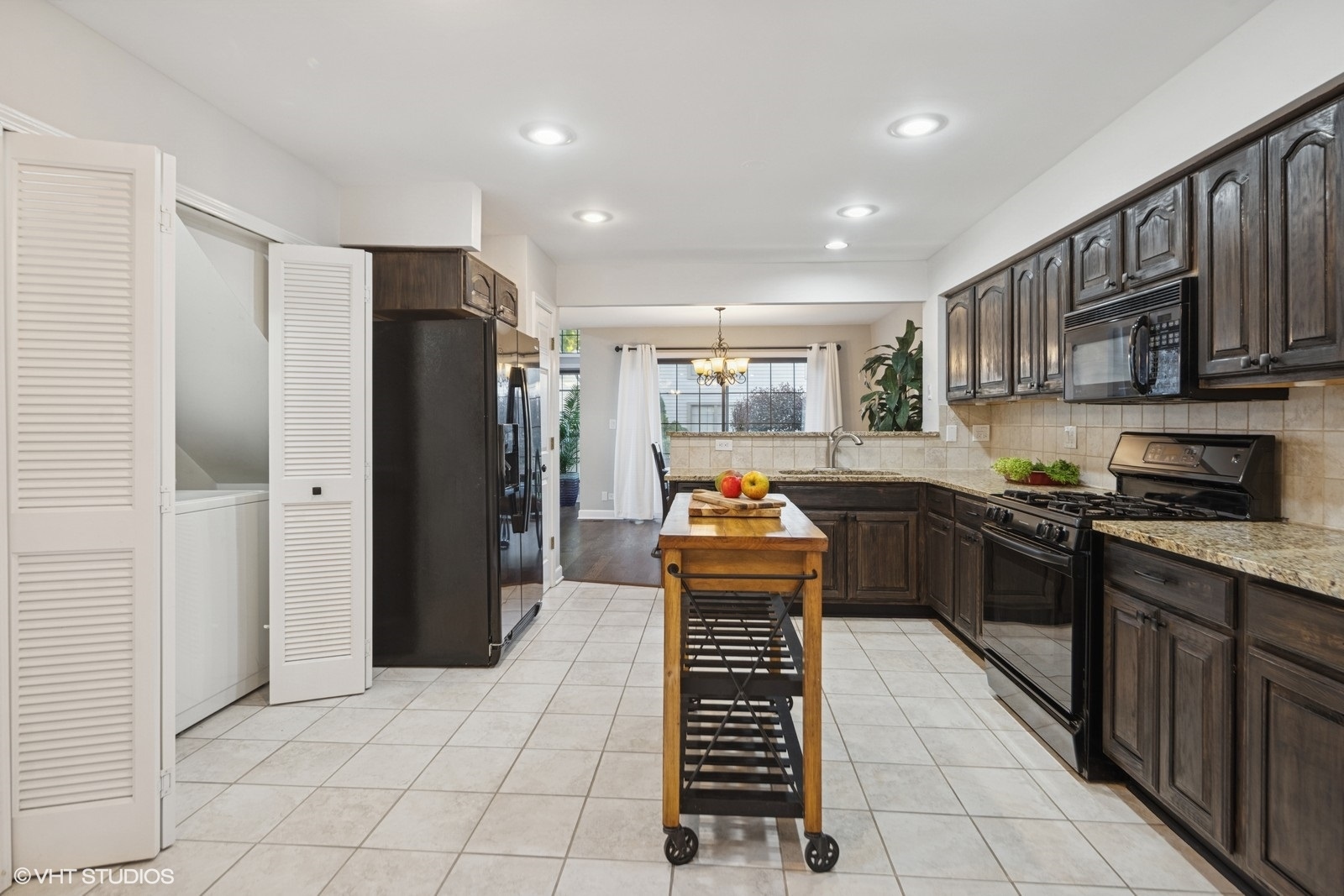 199 Springdale Lane Bloomingdale, IL 60108 - Photo 17 of 70 a kitchen with stainless steel appliances granite countertop a refrigerator and a stove top oven