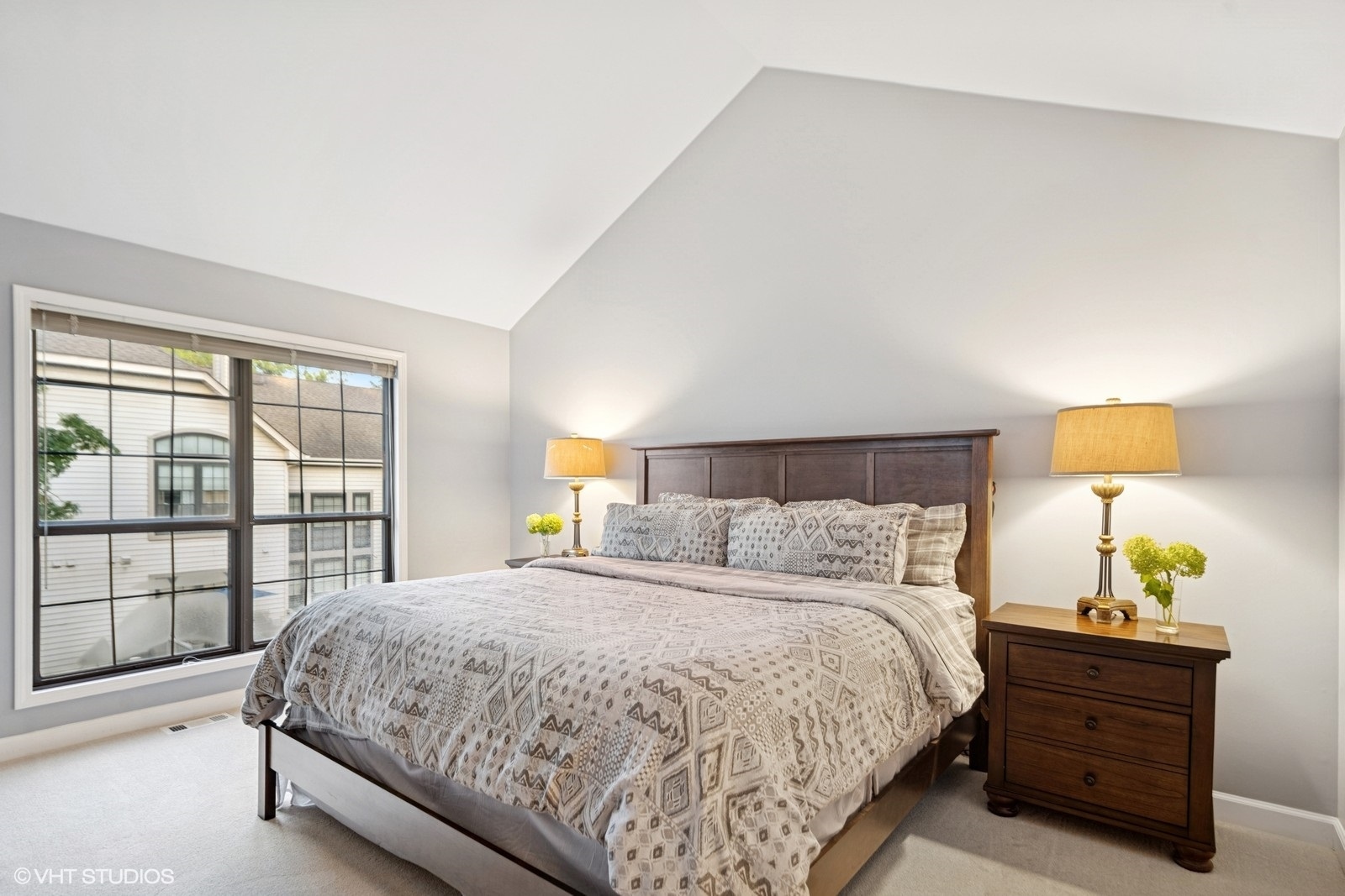 199 Springdale Lane Bloomingdale, IL 60108 - Photo 27 of 70 a bedroom with a bed and a lamp next to a window