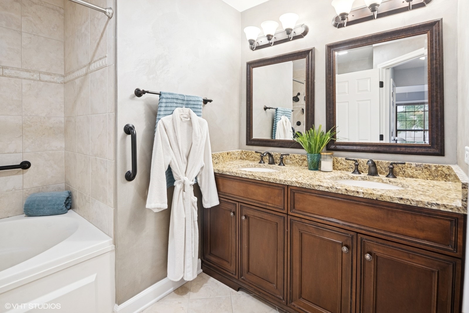 199 Springdale Lane Bloomingdale, IL 60108 - Photo 29 of 70 a bathroom with a granite countertop sink and a mirror