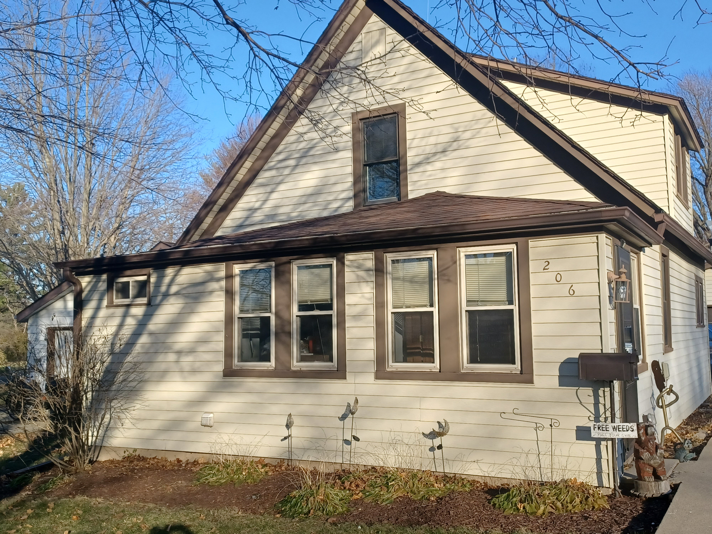 a view of house with a tree