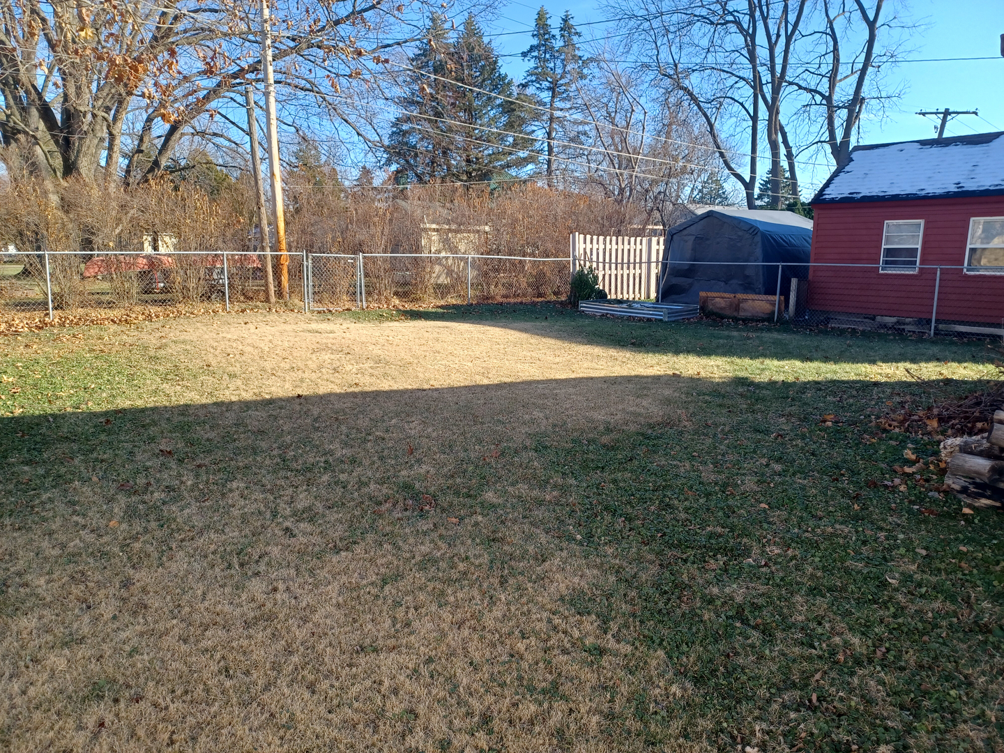 206 South Stott Street Genoa, IL 60135 - Photo 17 of 18 a view of a yard with a house