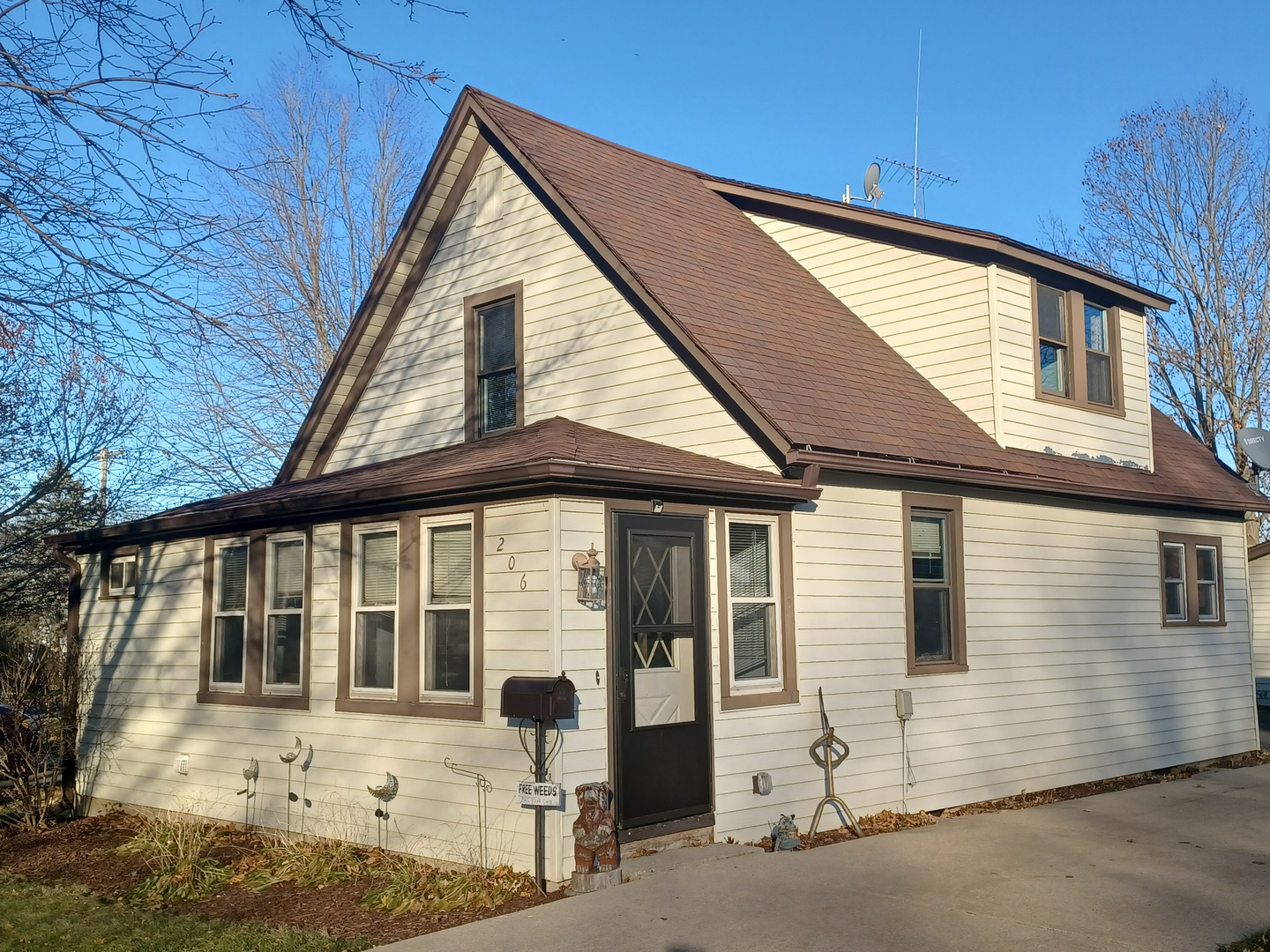 206 South Stott Street Genoa, IL 60135 - Photo 2 of 18 a front view of a house with a yard