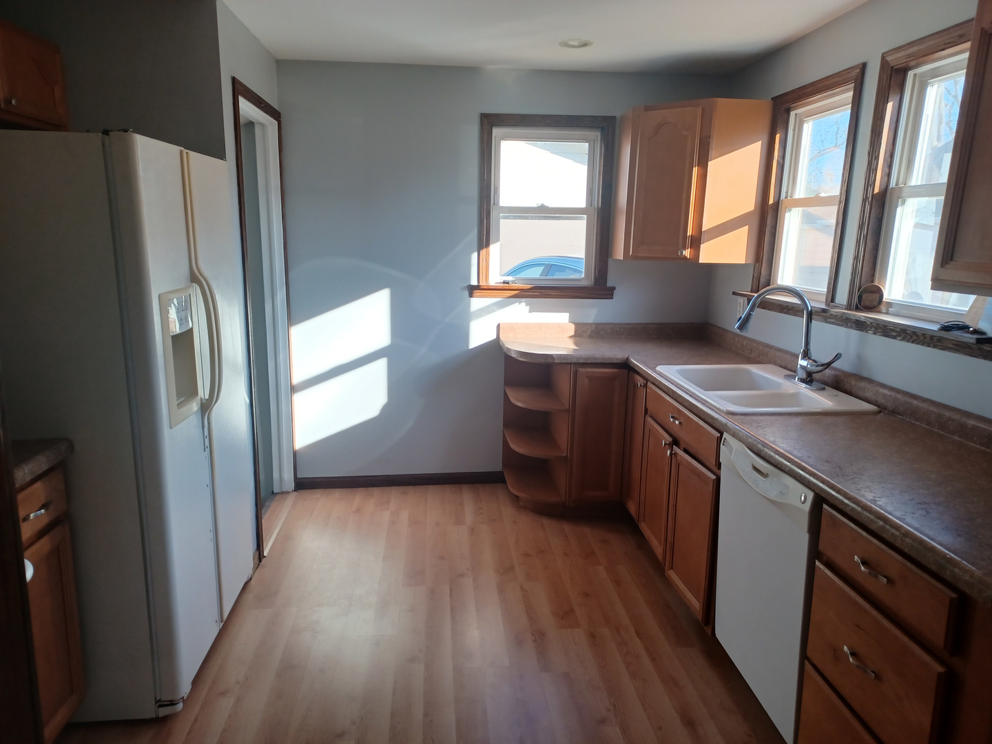 206 South Stott Street Genoa, IL 60135 - Photo 6 of 18 a kitchen with stainless steel appliances granite countertop a sink stove and refrigerator