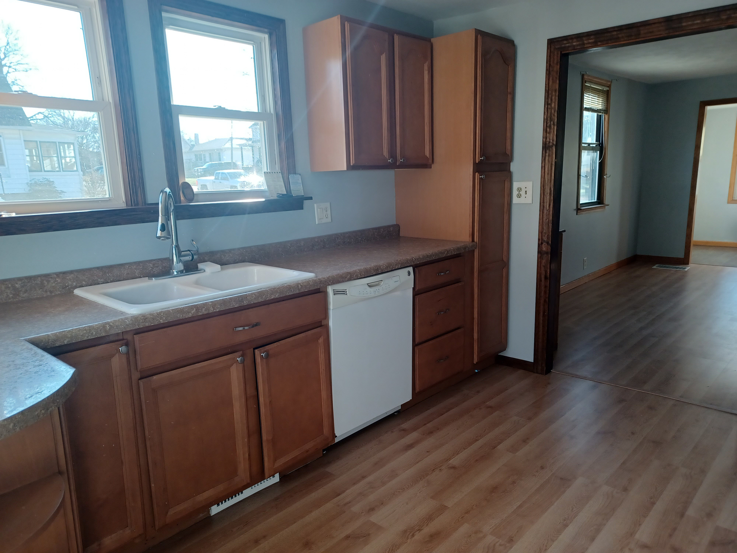 206 South Stott Street Genoa, IL 60135 - Photo 8 of 18 a kitchen with stainless steel appliances granite countertop a sink a stove a refrigerator and wooden cabinets