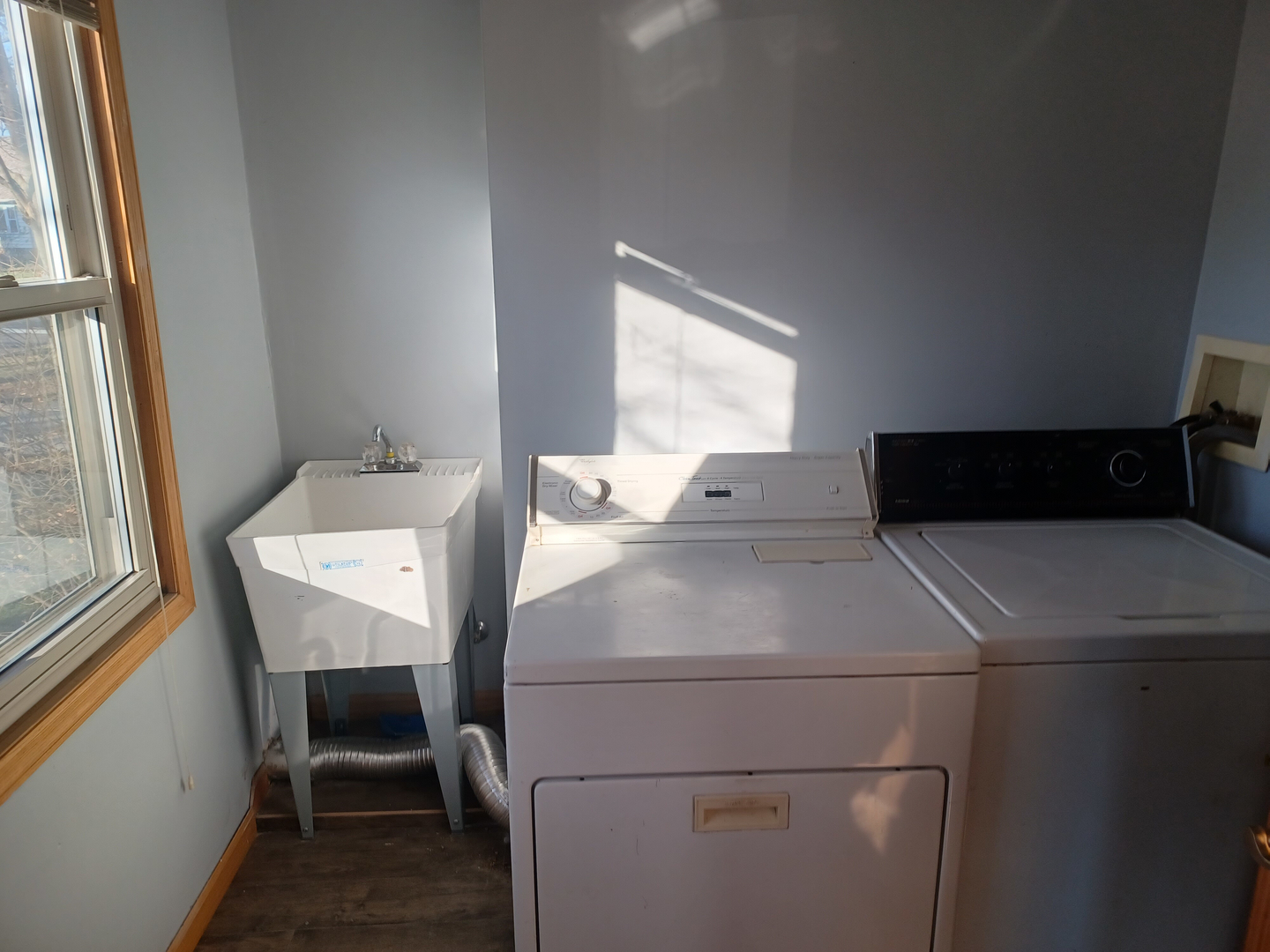 206 South Stott Street Genoa, IL 60135 - Photo 9 of 18 a utility room with dryer and washer