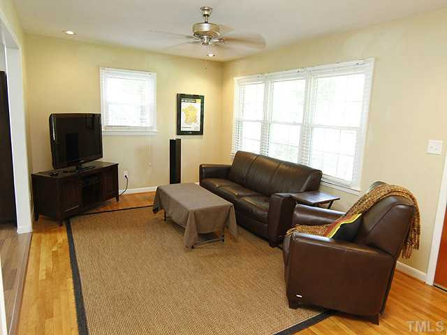 1812 Euclid Road Durham, NC 27713 - Photo 3 of 13 a living room with furniture and a flat screen tv