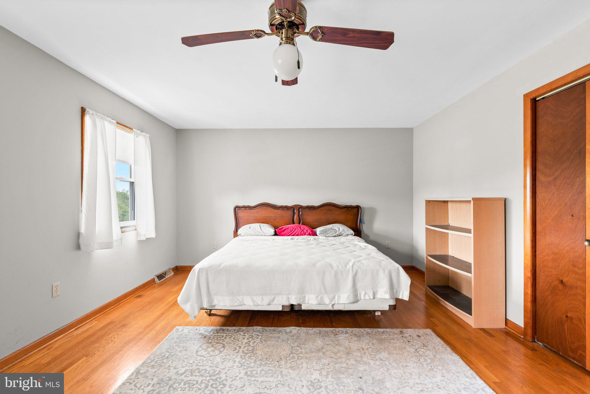 10110 Old Liberty Road Frederick, MD 21701 - Photo 12 of 65 a bedroom with a bed and window
