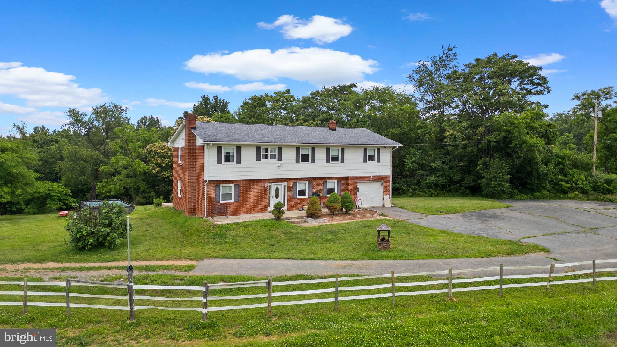 10110 Old Liberty Road Frederick, MD 21701 - Photo 2 of 65 a view of a house with a big yard