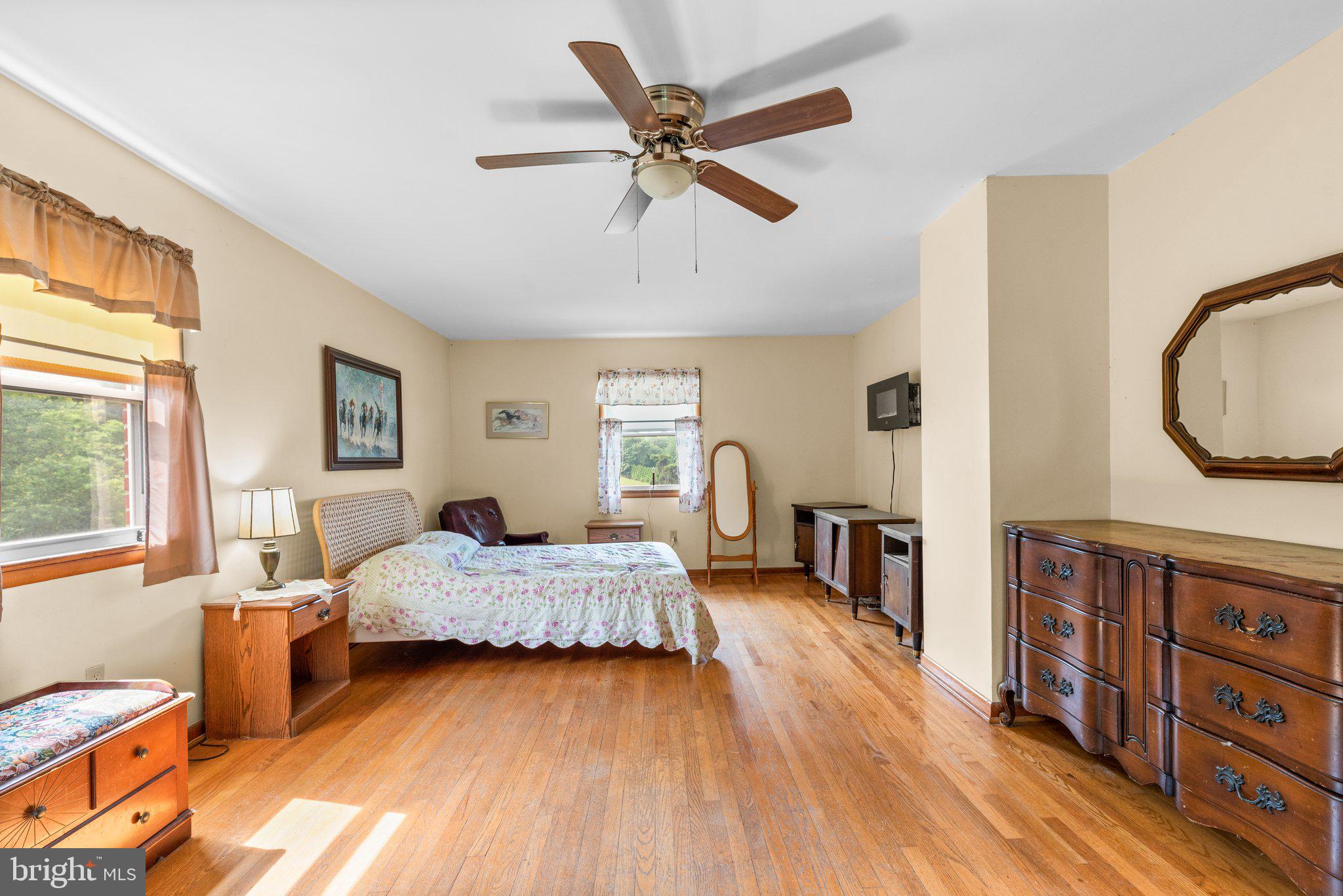 10110 Old Liberty Road Frederick, MD 21701 - Photo 22 of 65 a living room with furniture and a wooden floor