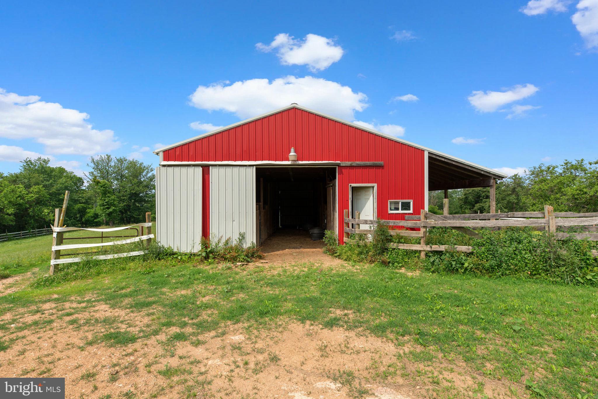 10110 Old Liberty Road Frederick, MD 21701 - Photo 28 of 65 a front view of a house with a yard
