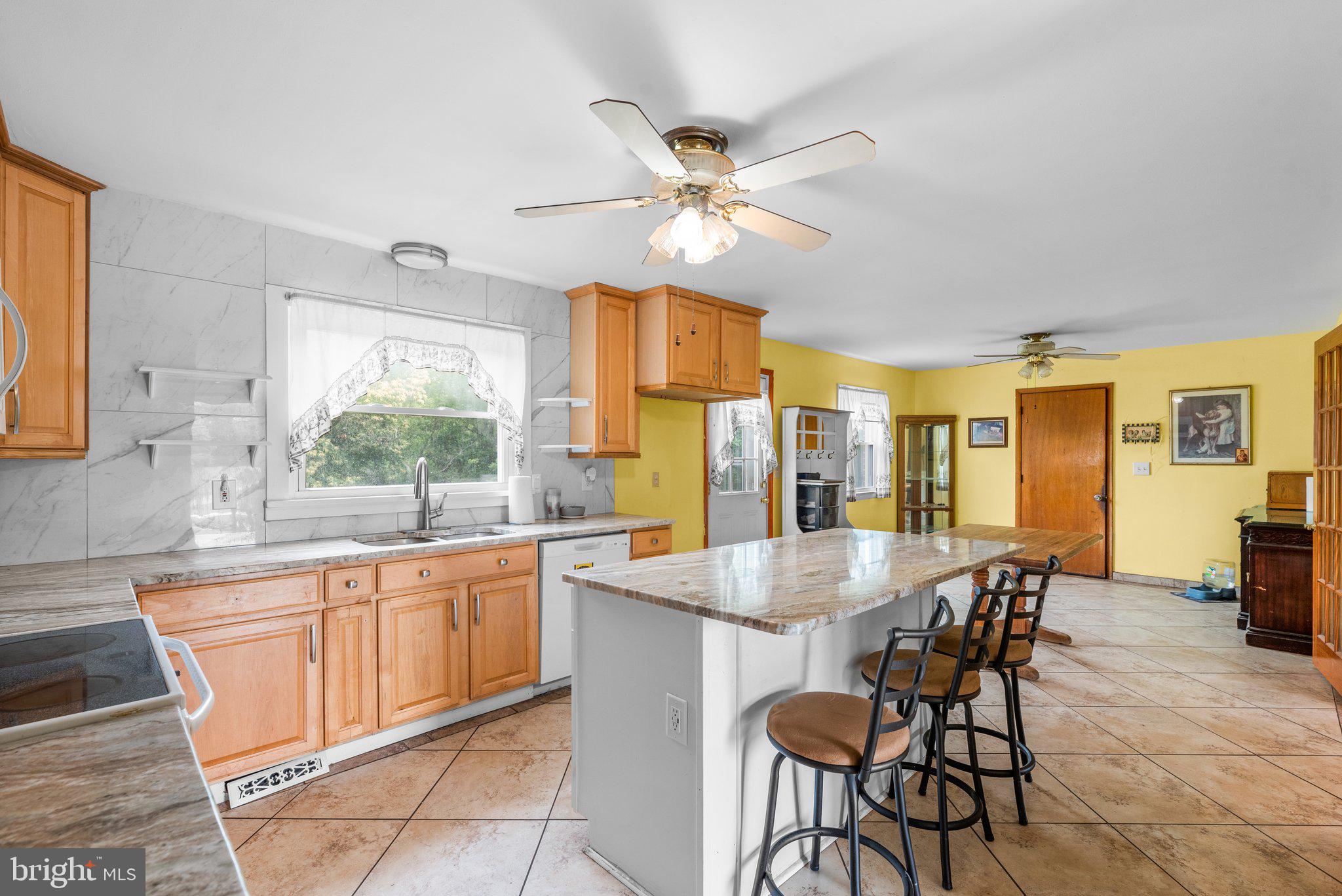 10110 Old Liberty Road Frederick, MD 21701 - Photo 3 of 65 a dining room with stainless steel appliances granite countertop furniture and a window