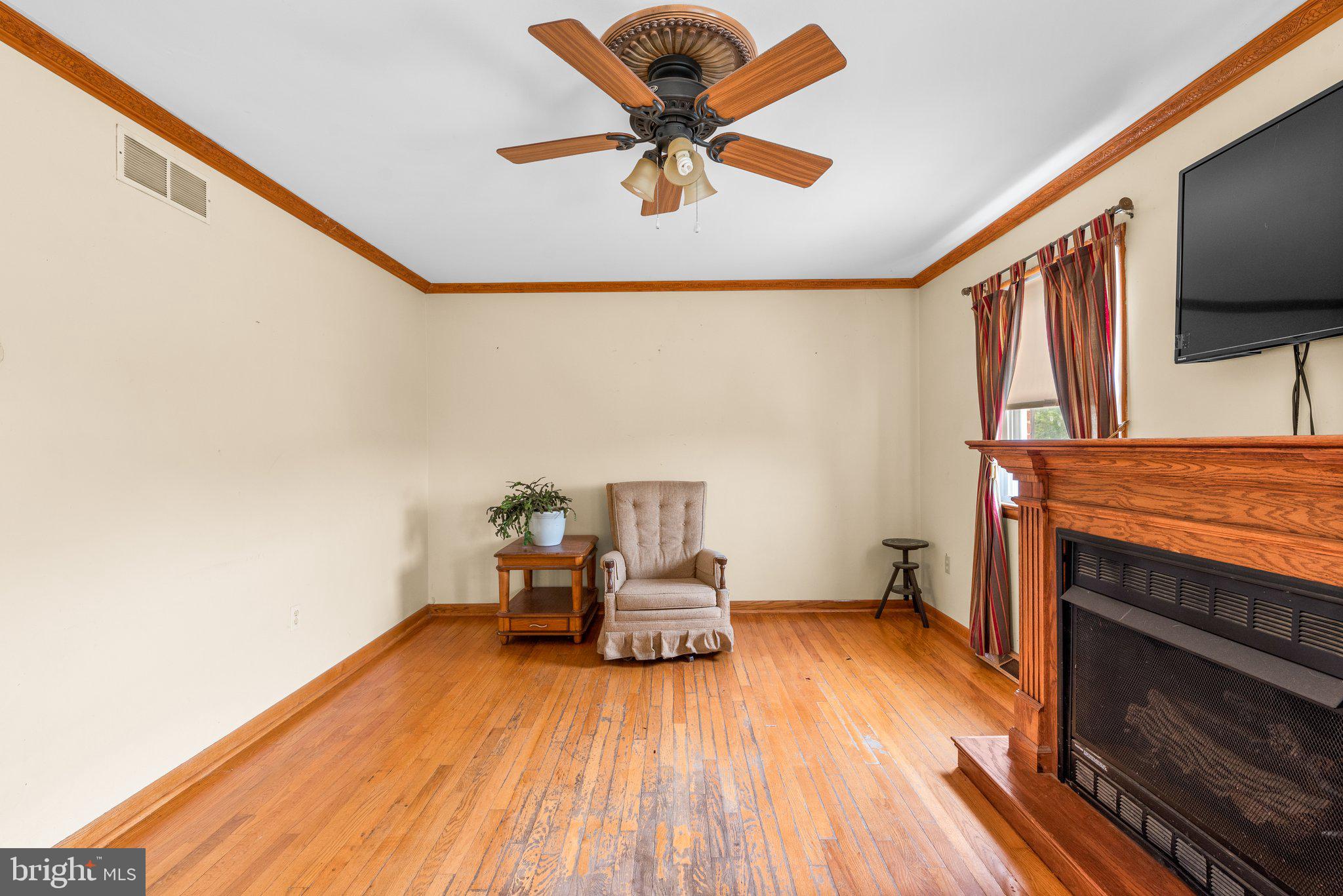 10110 Old Liberty Road Frederick, MD 21701 - Photo 32 of 65 a view of workspace with wooden floor and ceiling fan