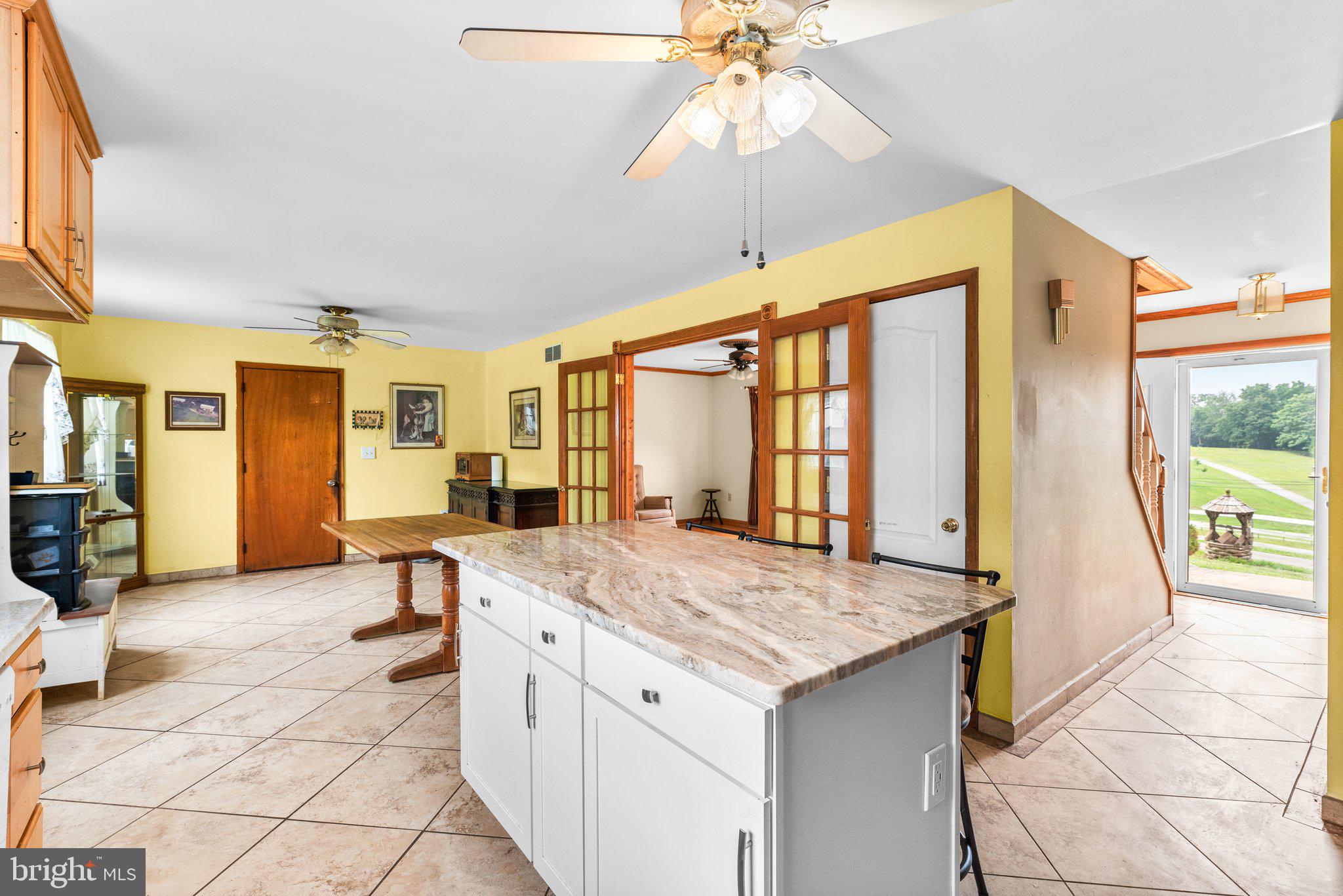 10110 Old Liberty Road Frederick, MD 21701 - Photo 60 of 65 a view of living room with granite countertop furniture and fireplace