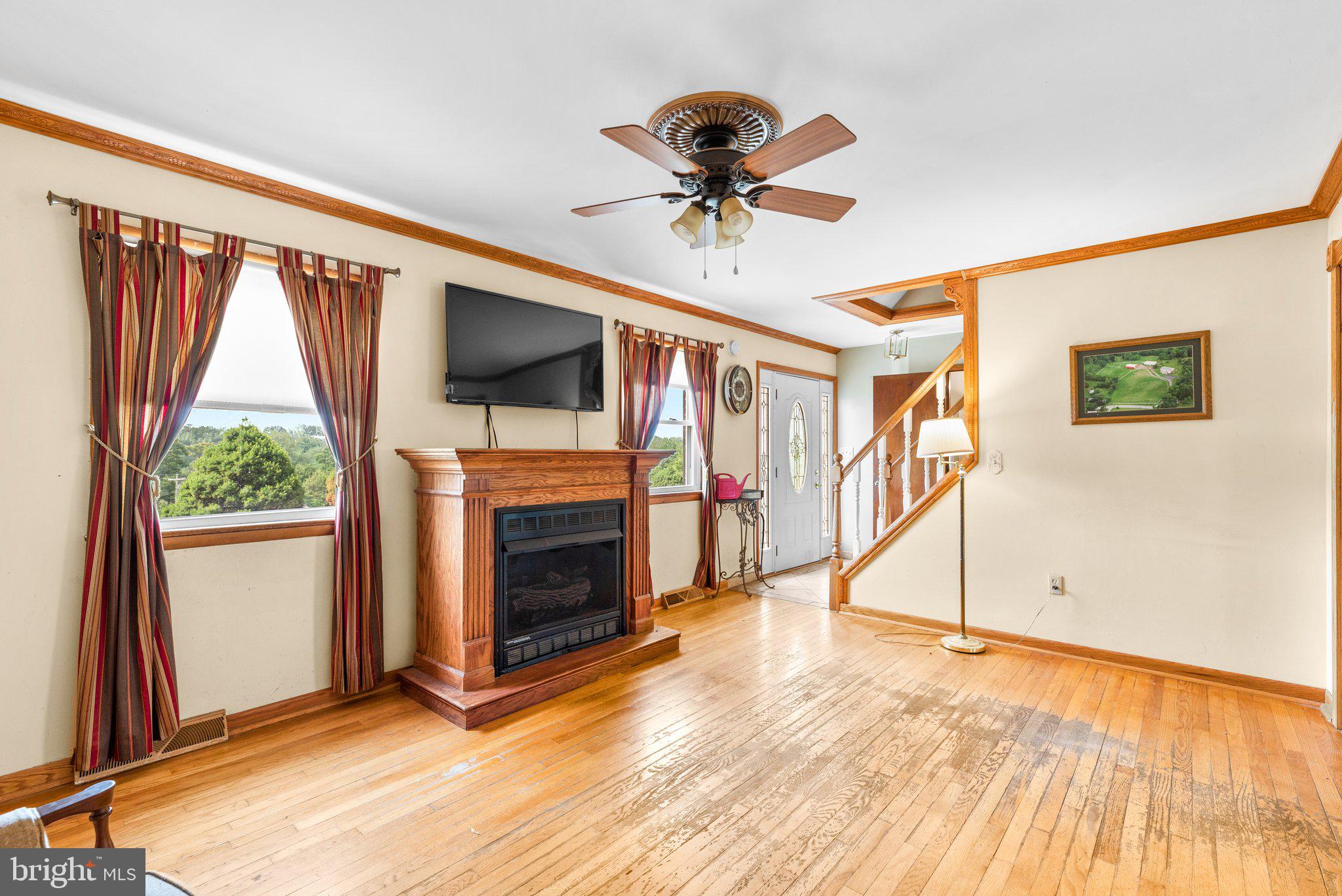 10110 Old Liberty Road Frederick, MD 21701 - Photo 61 of 65 a view of an empty room with a fireplace and a window