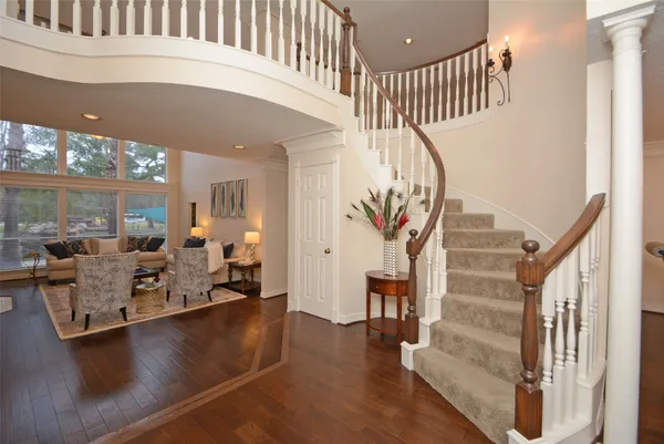 a view of a livingroom with furniture and stairs