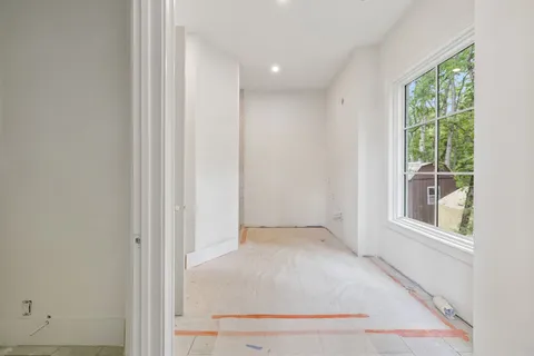 a bathroom with a shower and a sink