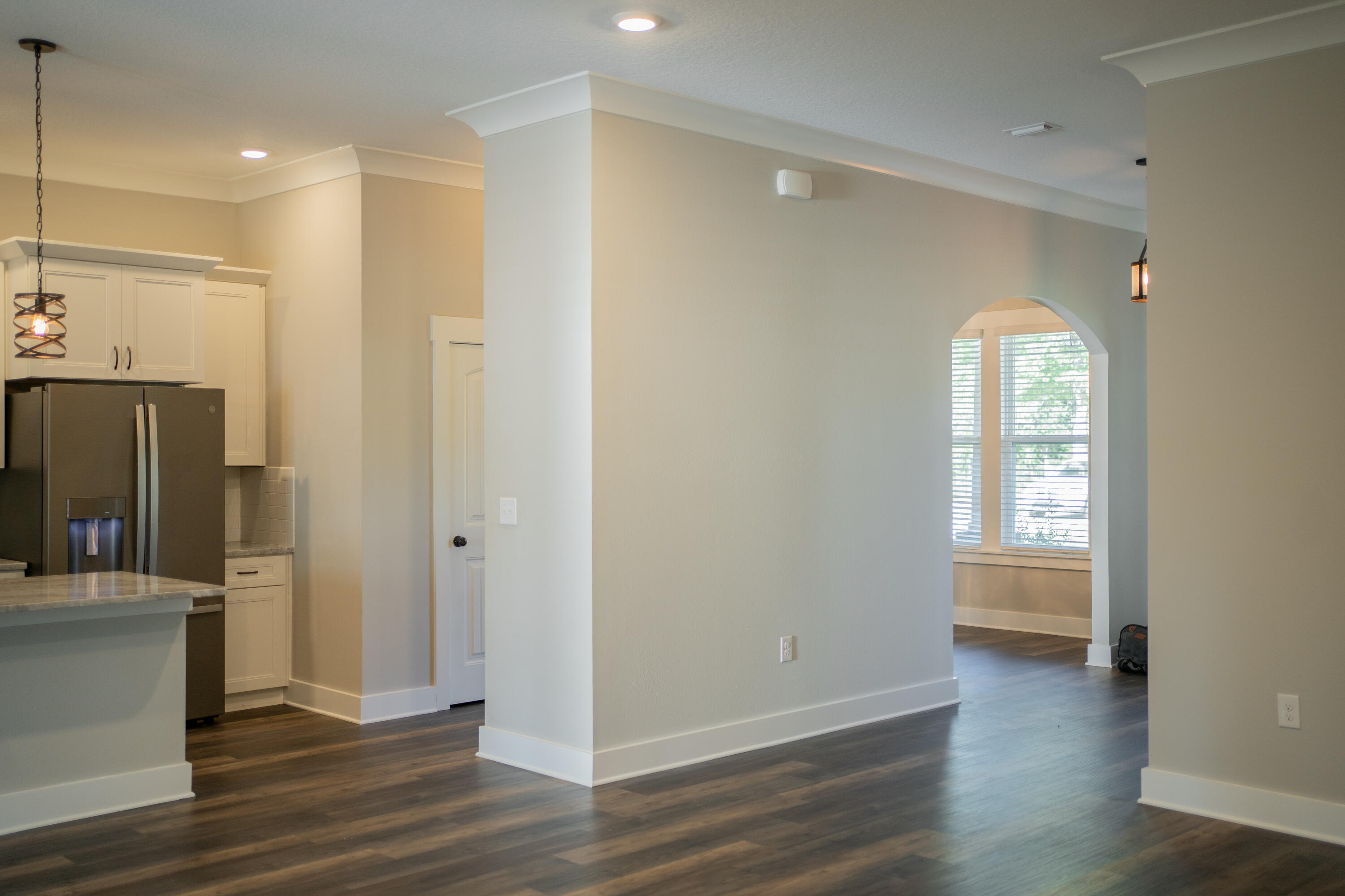 6157 Buckward Road Baker, FL 32531 - Photo 17 of 61 a view of empty room with wooden floor and fan