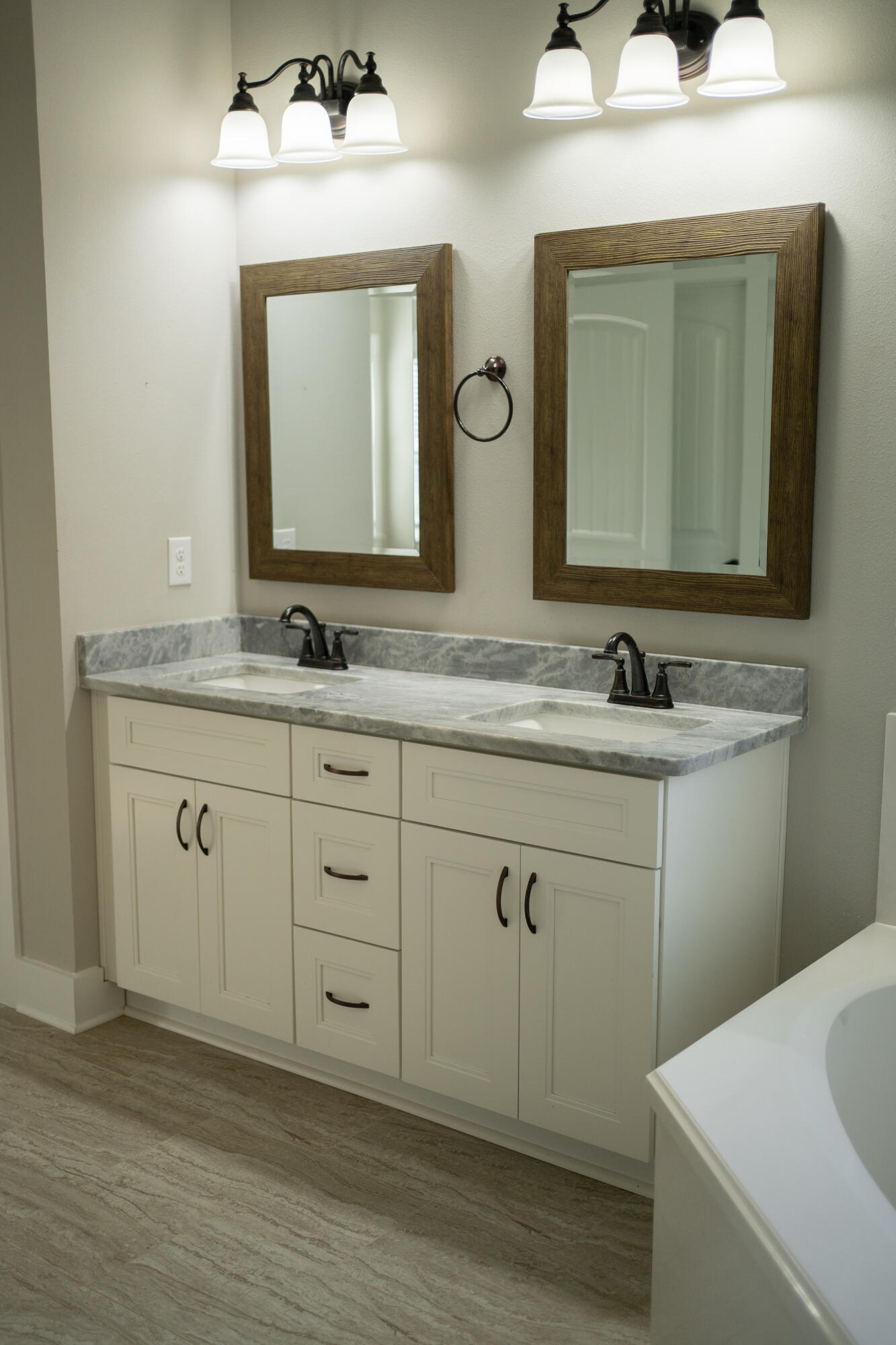 6157 Buckward Road Baker, FL 32531 - Photo 33 of 61 a bathroom with a double vanity sink and mirror