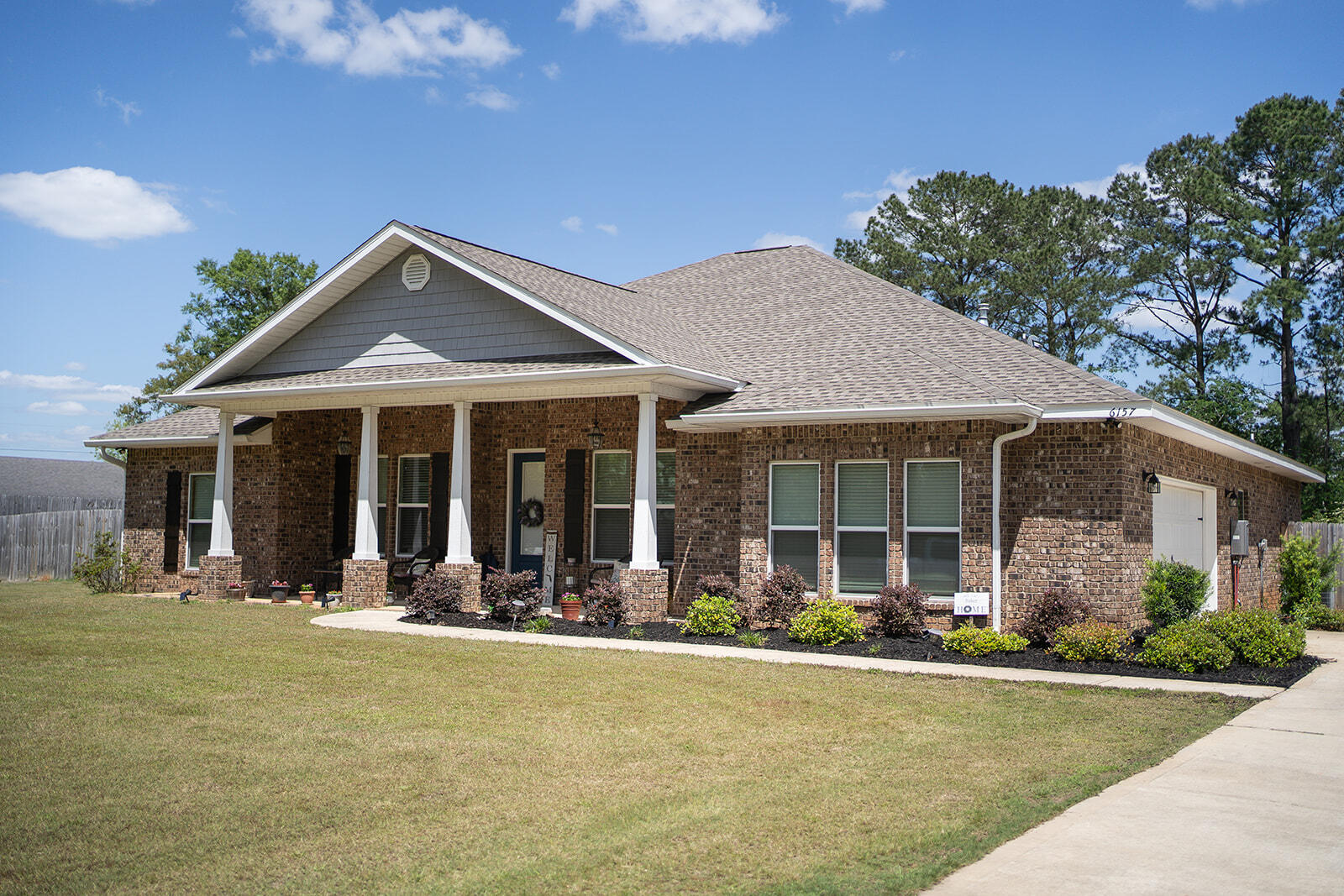 6157 Buckward Road Baker, FL 32531 - Photo 5 of 61 front view of a house with a patio