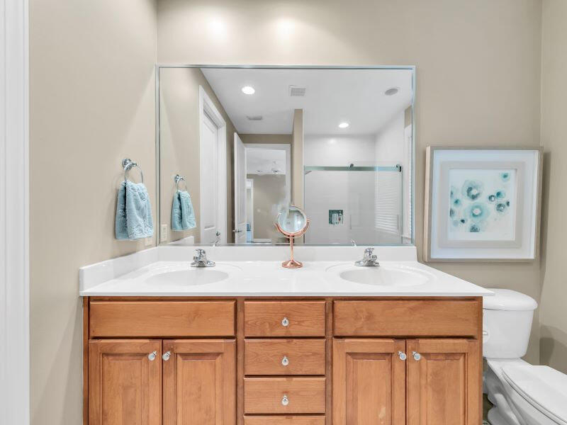 232 South Zander Way Santa Rosa Beach, FL 32459 - Photo 11 of 26 a bathroom with a double vanity sink and a mirror