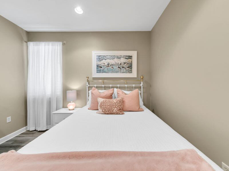 232 South Zander Way Santa Rosa Beach, FL 32459 - Photo 13 of 26 a bedroom with a large bed and a painting on the wall