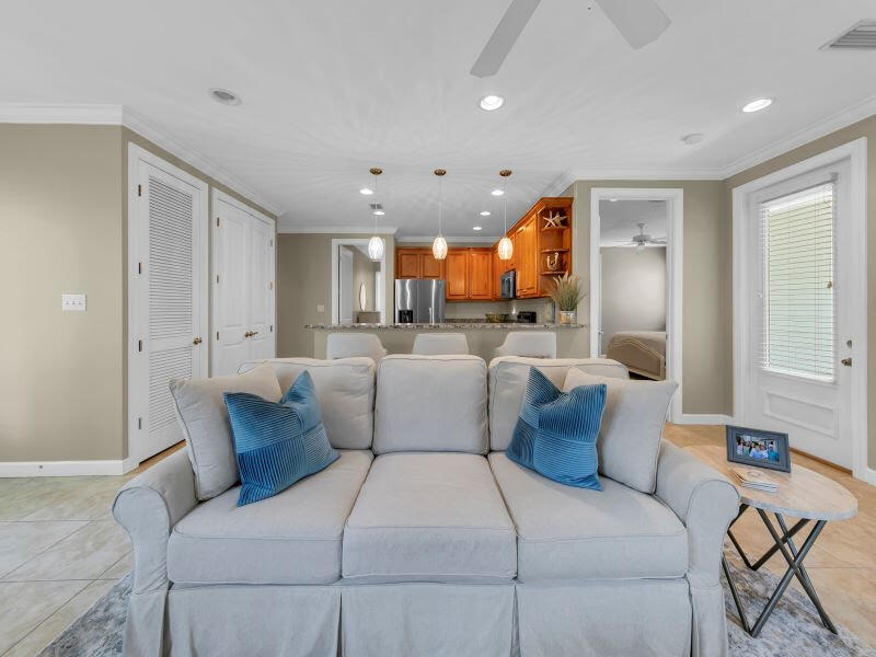 232 South Zander Way Santa Rosa Beach, FL 32459 - Photo 4 of 26 a bedroom with a large bed and a chandelier