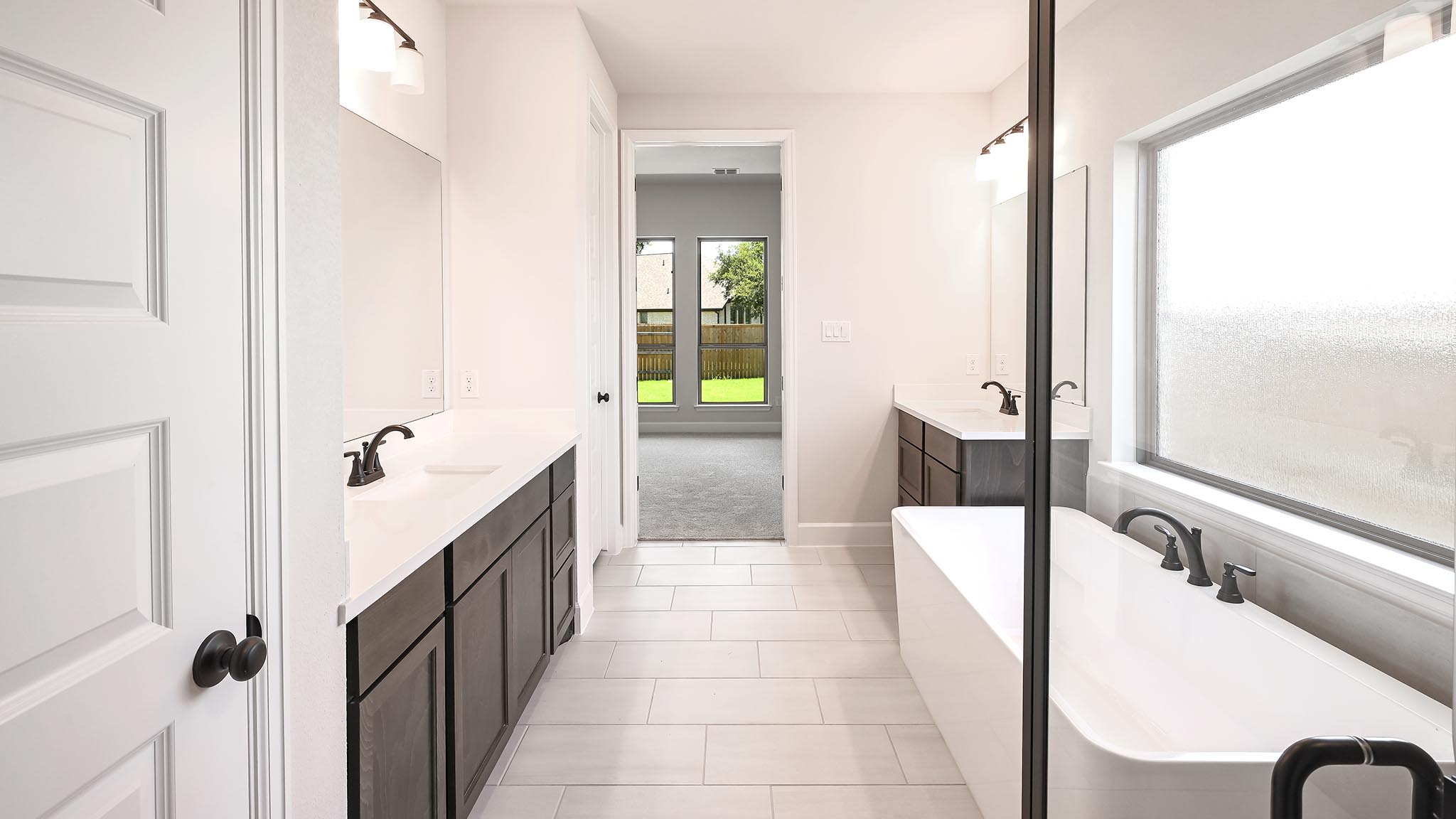 126 Basket Flower Loop Kyle, TX 78640 - Photo 20 of 29 a bathroom with a tub and shower