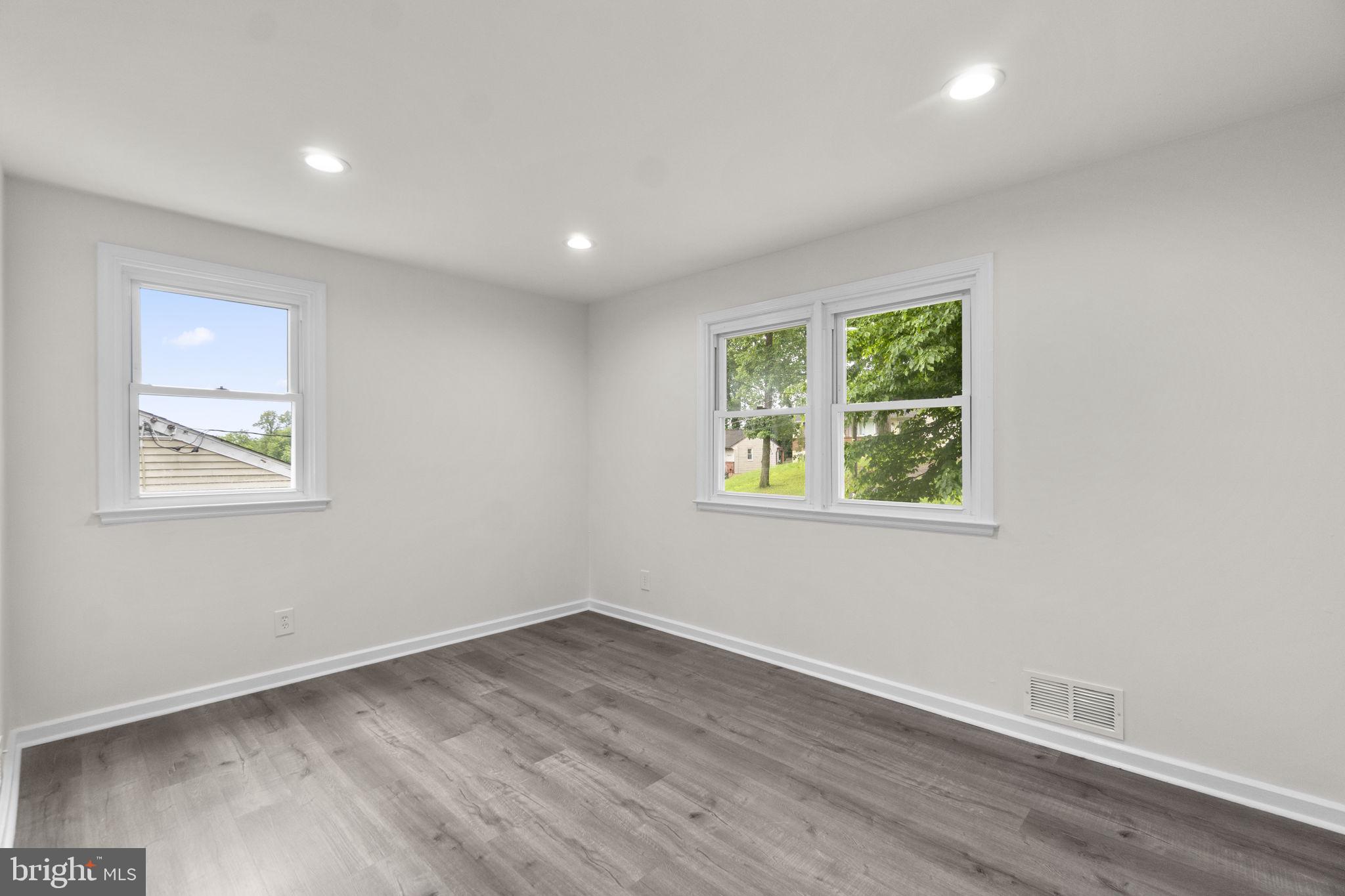 3658 Clifmar Road Baltimore, MD 21244 - Photo 7 of 43 an empty room with windows