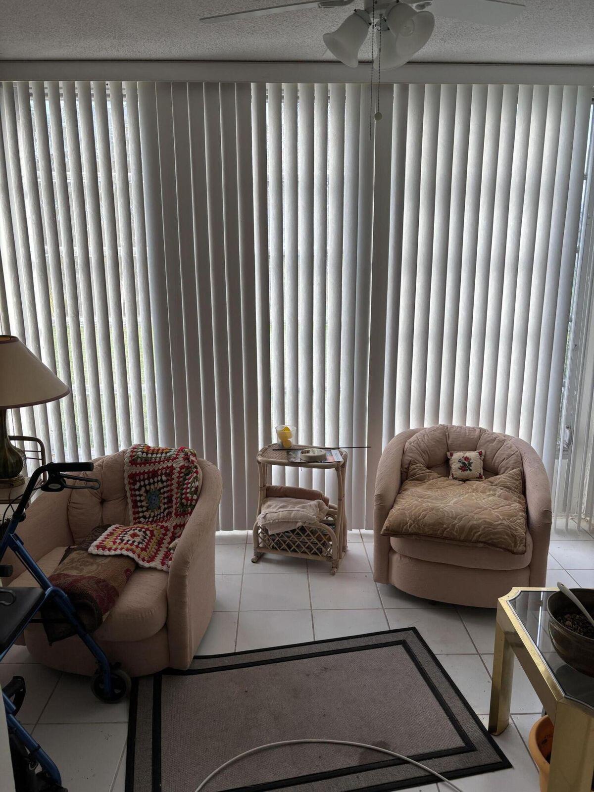 230 Northeast 26th Avenue, Unit 2140 Boynton Beach, FL 33435 - Photo 8 of 9 a living room with furniture and a window