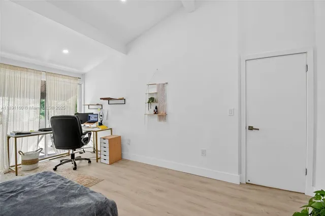 a bathroom with a double vanity sink a toilet and a mirror