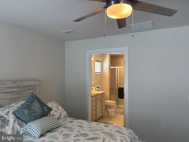 17 Senators Way Berlin, NJ 08009 - Photo 20 of 37 a bedroom with a bed and a chandelier