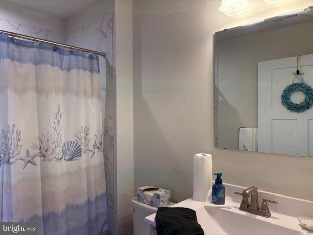 17 Senators Way Berlin, NJ 08009 - Photo 34 of 37 a bathroom with a sink and a mirror