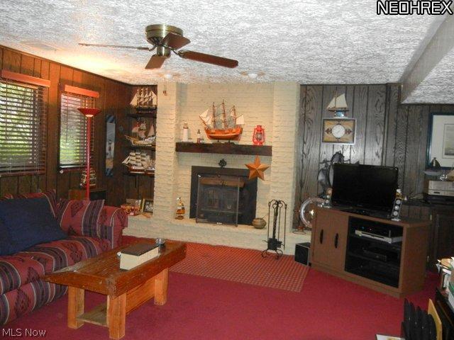 4210 Slaughter Road Uniontown, OH 44685 - Photo 21 of 25 Family room with wood burning fireplace on lower level.