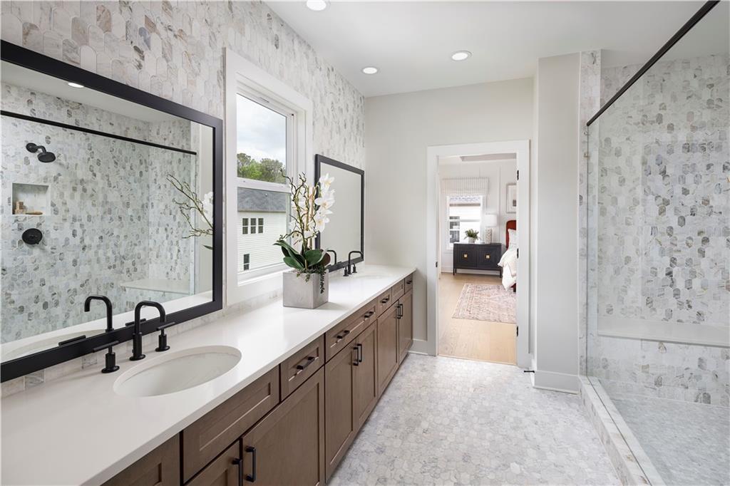 760 Keystone Drive Woodstock, GA 30188 - Photo 13 of 26 a large bathroom with a double vanity sink a mirror and shower