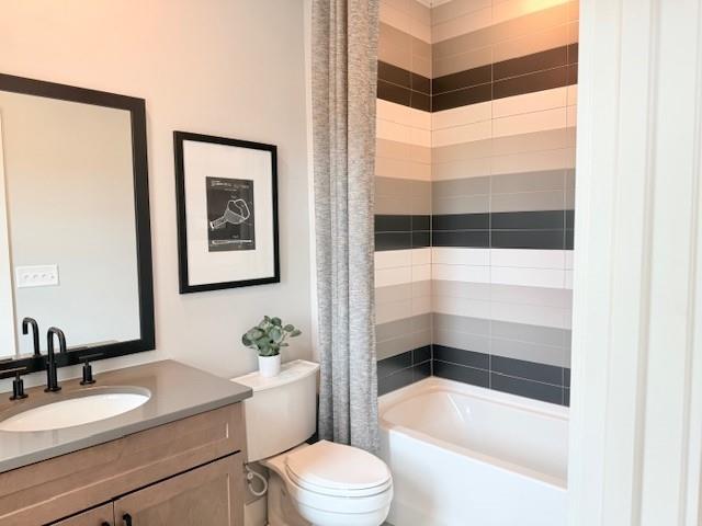 760 Keystone Drive Woodstock, GA 30188 - Photo 16 of 26 a bathroom with a sink a toilet and a bathtub