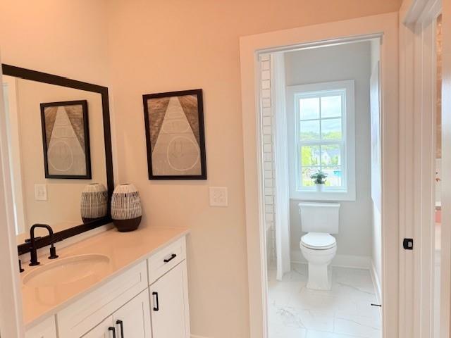 760 Keystone Drive Woodstock, GA 30188 - Photo 18 of 26 a bathroom with a toilet sink and mirror