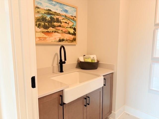 760 Keystone Drive Woodstock, GA 30188 - Photo 24 of 26 a bathroom with a sink and a mirror