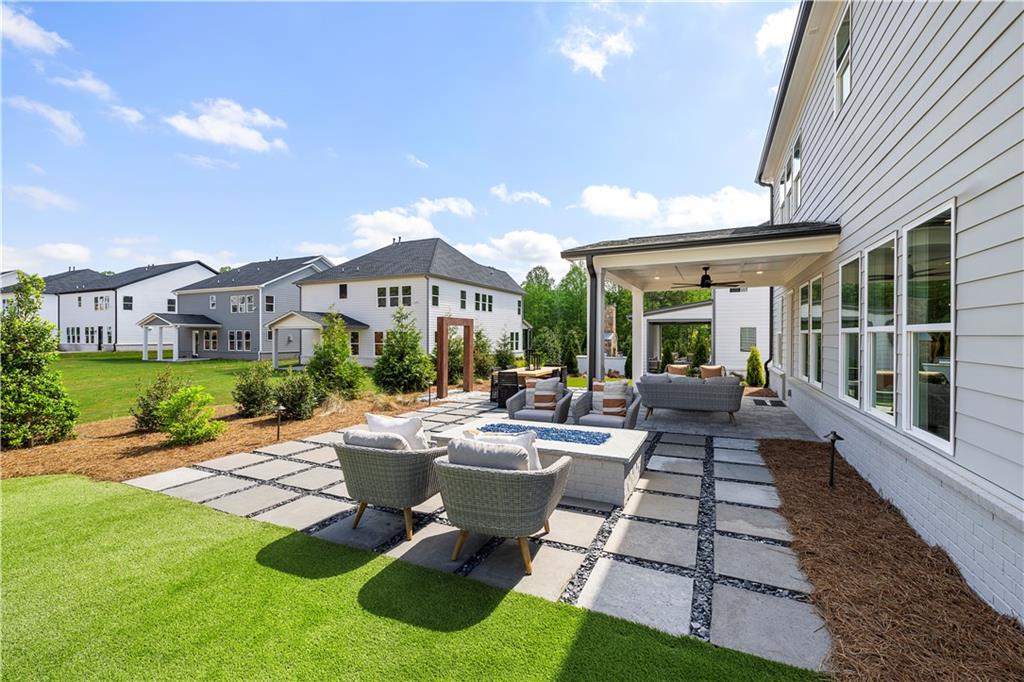 760 Keystone Drive Woodstock, GA 30188 - Photo 26 of 26 a view of a patio with couches table and chairs and potted plants