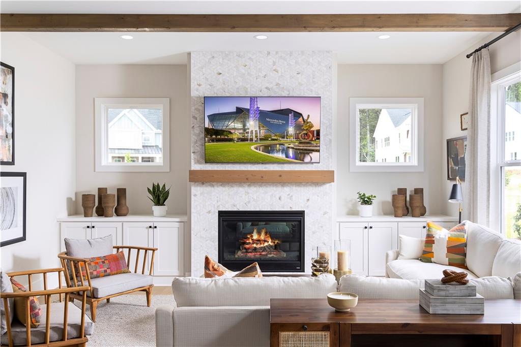 760 Keystone Drive Woodstock, GA 30188 - Photo 4 of 26 a living room with furniture and a fireplace