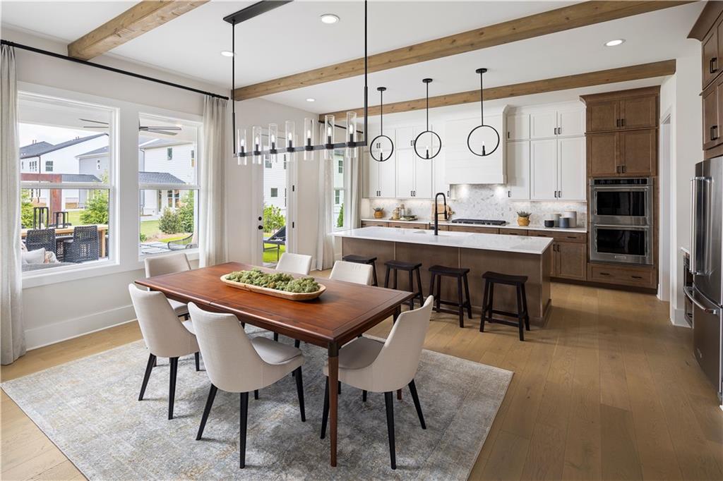 760 Keystone Drive Woodstock, GA 30188 - Photo 5 of 26 a view of a a dining table chairs and chandelier