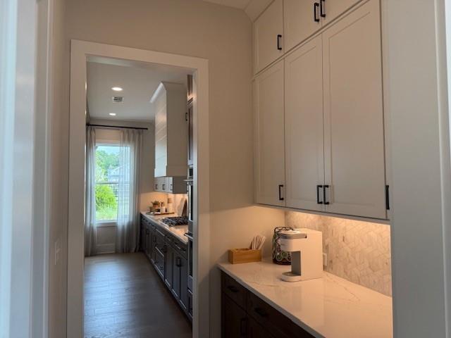 760 Keystone Drive Woodstock, GA 30188 - Photo 6 of 26 a en suite bathroom with a sink a tub and a mirror