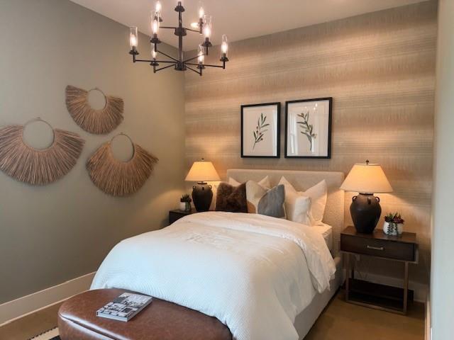 760 Keystone Drive Woodstock, GA 30188 - Photo 7 of 26 a bedroom with a bed and a chandelier